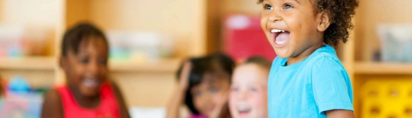 Excited four year old learning daycare