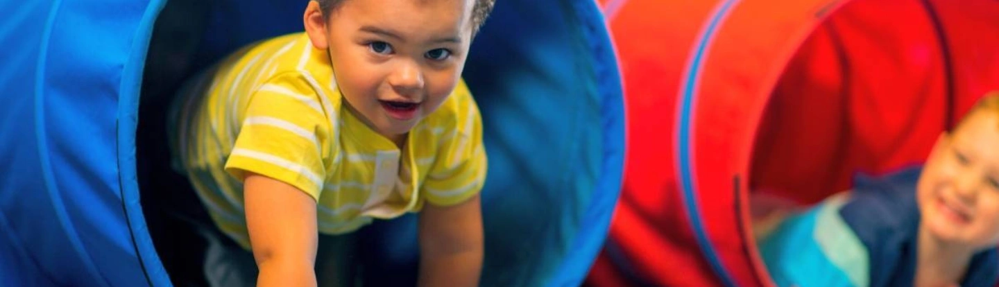 Toddlers exploring daycare classroom